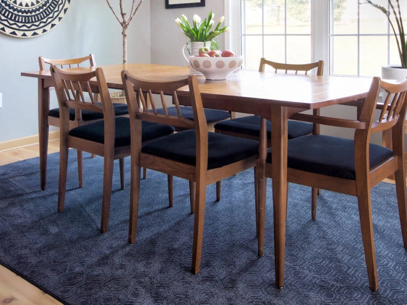 Dining room with blue rug